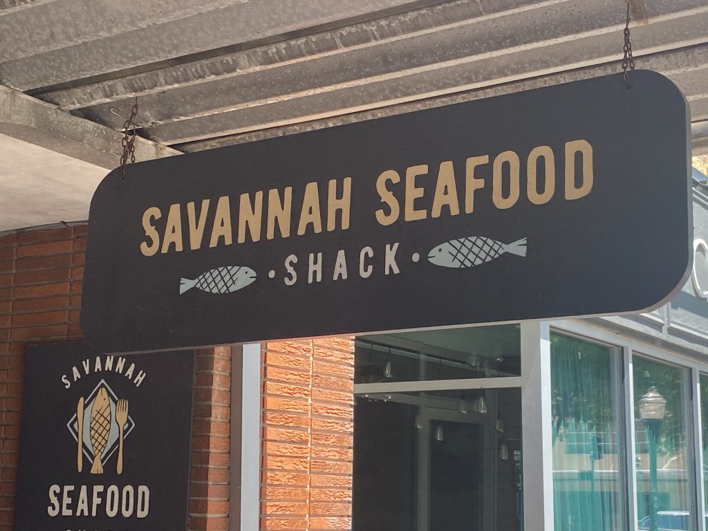 The sign of the Savannah Seafood Shack. At night, especially on the weekends, there's a long line. Mid-week is easier to get a table.