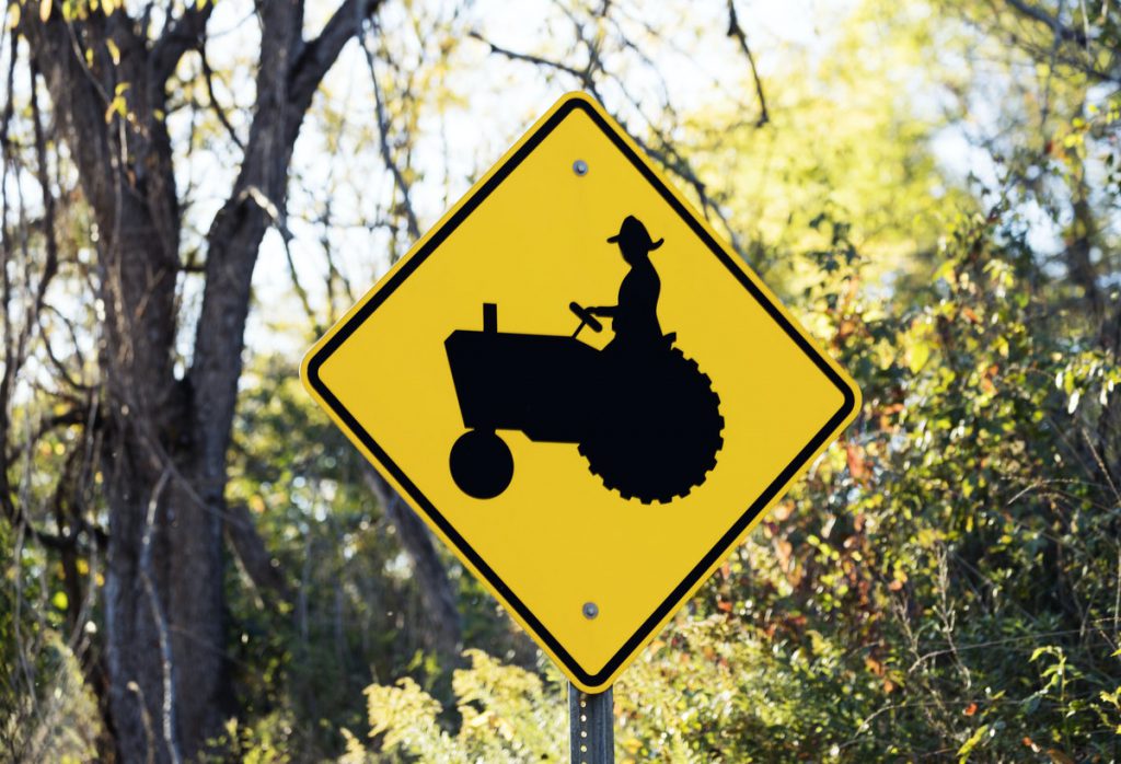 A picture of a tractor crossing sign, representing something that is slow.
